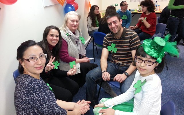 Parents and children at a social event in the school